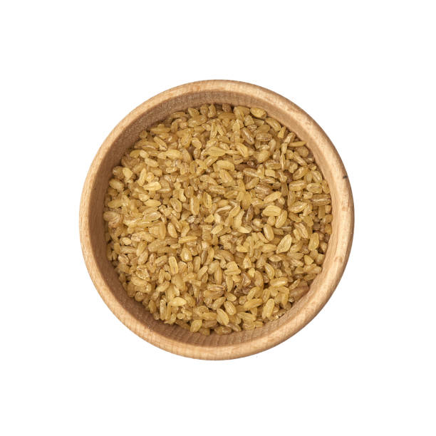 istock Bulgur groats in a small wooden bowl on a white background 1222620273
