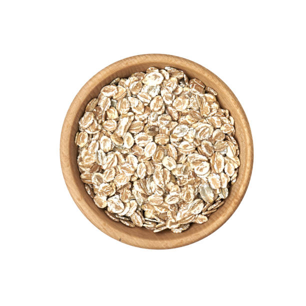 istock Rye flakes in a small wooden bowl on a white background 1222620397