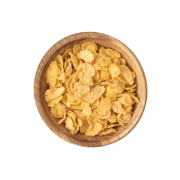 istock Cornflakes in a small bowl of wood on a white background 1222620515