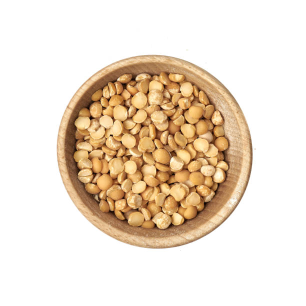 istock Peas in a small wooden bowl on a white background 1222620644