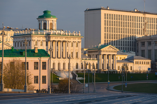 St. Petersburg, Russia, February 10, 2024.  A beautiful building in the city center, built in the 19th century according to the design of Stackenschneider, a political palace, now the Legislative Assembly, in the classicist style with Baroque elements, with porticoes and columns, sculptures and friezes, an architectural monument, a city landmark, a square with a parking lot, a winter view, city landscape.