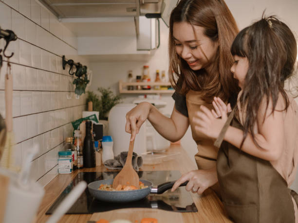 istock Happy asian family in the kitchen. 1222623209