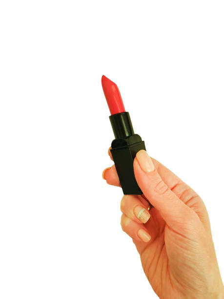 istock hand holds lipstick isolated on white background 1222623211