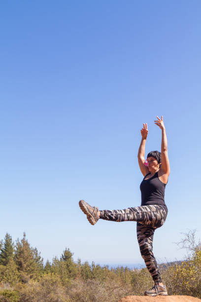 istock Mature Woman doing pilates exercises outsite 1222623512
