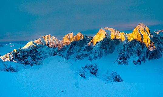 Sunrise over alaskan mountain covered in snow in Denali national park