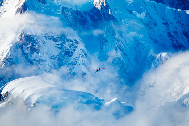 istock Small airplane flying in the Alaska mountains 1222623794