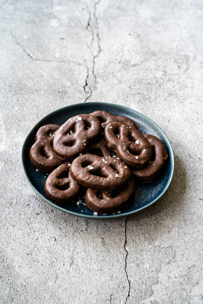 istock Dark Bitter Chocolate Covered Pretzels with Sea Salt. 1222626083