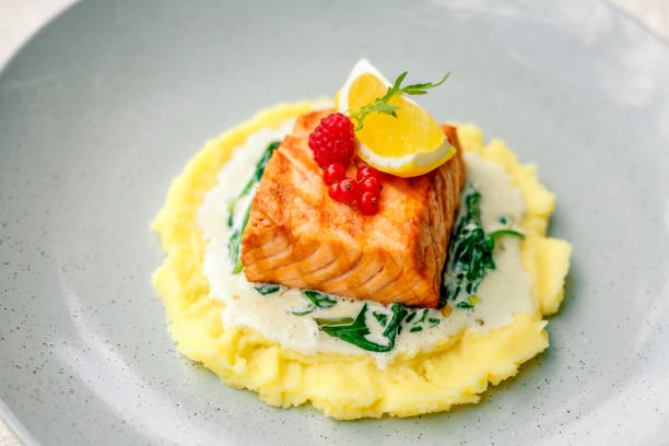 istock fried fish with mashed potatoes and cream sauce 1222626156