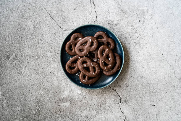 istock Dark Bitter Chocolate Covered Pretzels with Sea Salt. 1222626230