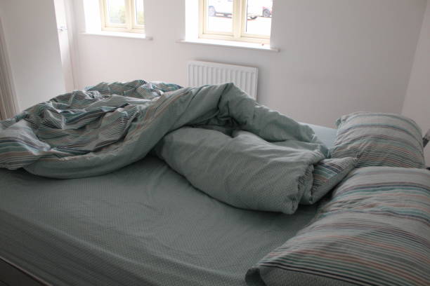 istock Lazy day with an unmade bed 1222626337