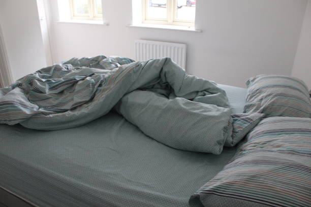 istock Lazy day with an unmade bed 1222626341