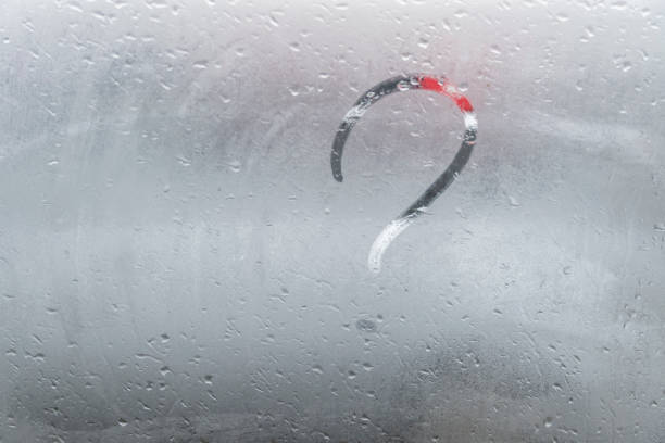 istock A question mark is drawn with a finger on a misted window. The question is painted on glass or on a mirror. 1222628586