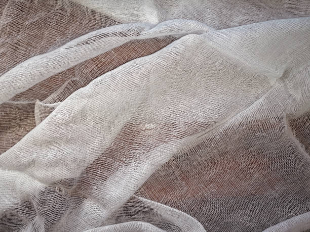 istock White texture of medical gauze lying wavy on a brown surface 1222628715