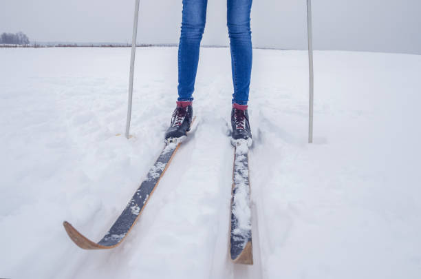 istock Slim girl skiing, legs close up 1222628767