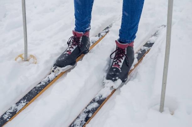 istock Slim girl skiing, legs close up 1222628818