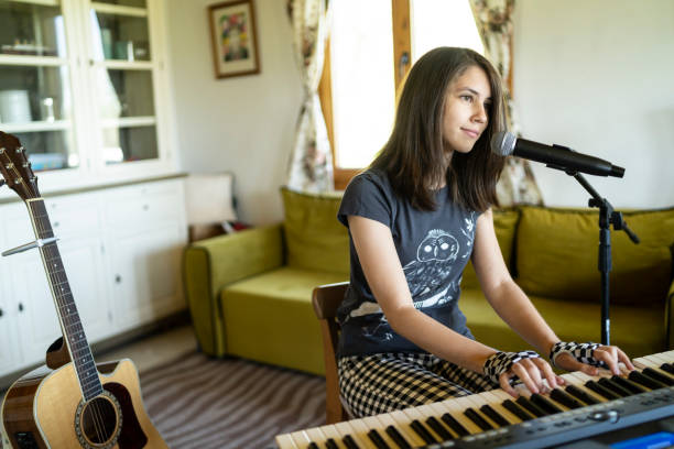 istock Playing the piano and singing at home 1222631115