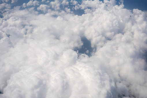 Panorama sky from altitude in the cumulus and layered stratus clouds, Cloud and blue sky from the airplane windows