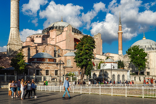 ISTANBUL, TURKEY - AUGUST 21, 2018: museum Hagia Sophia and tourists in sunny summer day