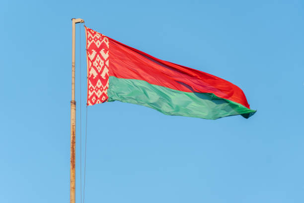 istock Belarus National Flag Waving on pole against deep blue sky background. High Definition 1222634426