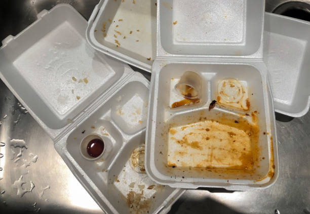 istock Three dirty empty styrofoam containers in a sink.  Top view.  Food containers after use. Home delivery food. 1222635388