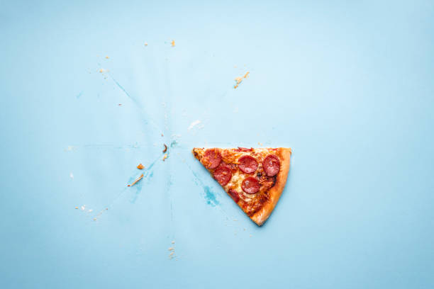istock Last sliced of pizza pepperoni on blue background. 1222638022