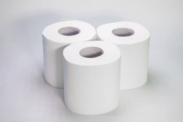 istock Three rolls of toilet paper stand on a white background 1222639320