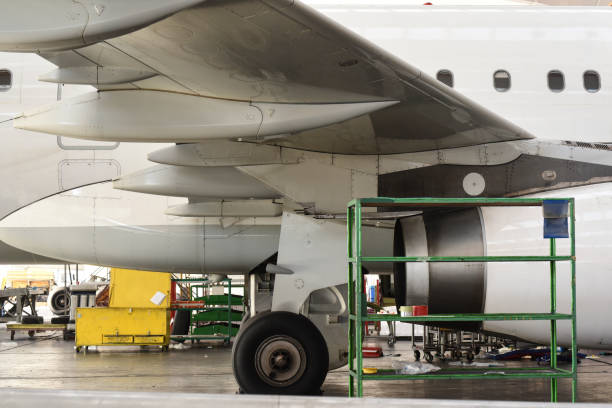 istock Aircraft maintenance in airplane hangar 1222639641