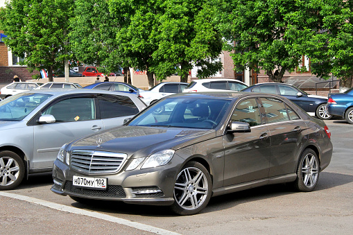 Ufa, Russia - May 25, 2012: Luxury motor car Mercedes-Benz E200 (W212) in the city street.