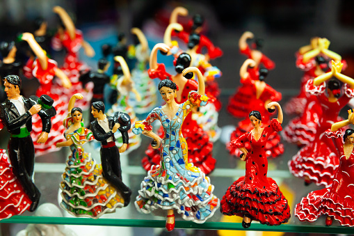 Famous Spanish handcrafted souvenirs flamenco dancers figurines displayed in shop for sale