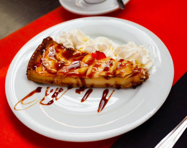 istock Tasty apple pie with caramel and dairy cream at plate 1222643033