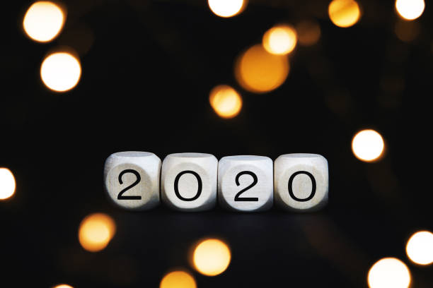 istock Wooden cubes with 2020 numbers on a black background. 1222648243