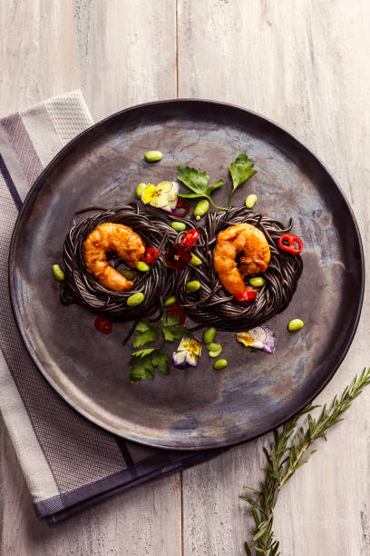 Squid ink spaghetti stock photo