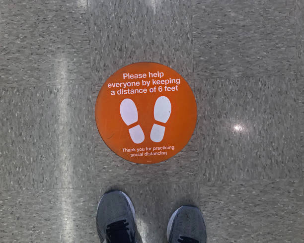 istock Social Distance Orange Floor Sign Circular 1222649313
