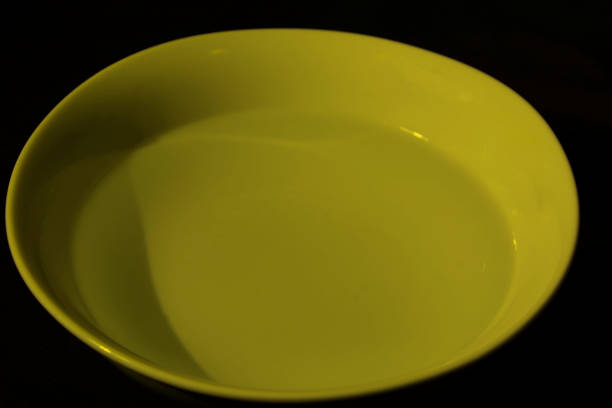 istock White bowl filled with water on black background 1222649503