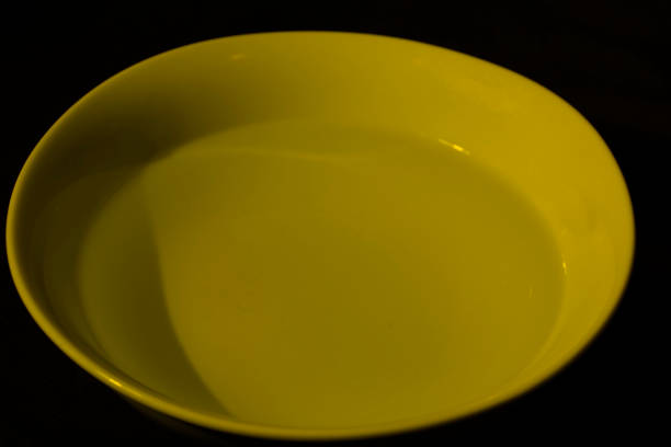 istock White bowl filled with water on black background 1222649504