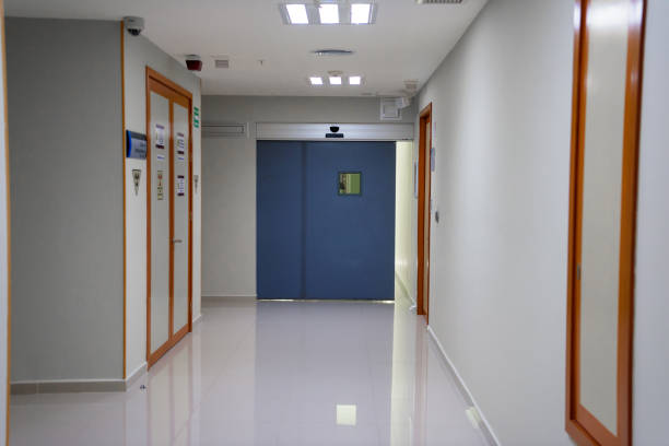 istock A huge blue door in a white corridor in a hospital. 1222650708