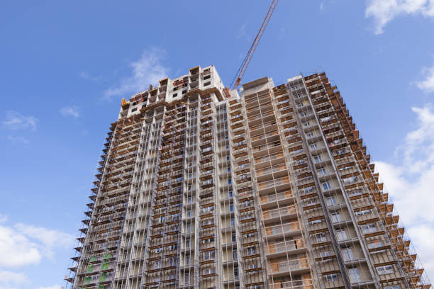 istock Construction crane building a new high-rise skyscraper or apartment building 1222651198