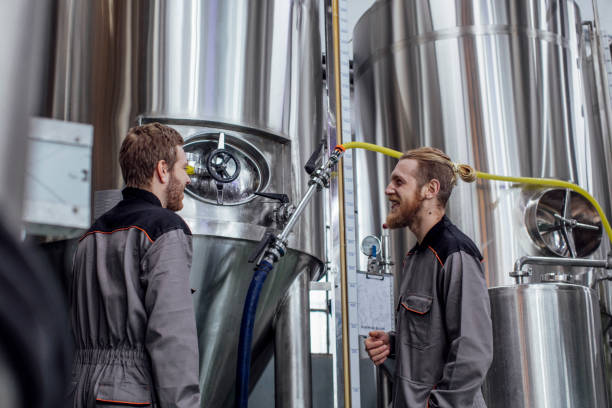 istock Craft Beer Industry Workers: Smiling Blond Men Having a Chat at Work 1222651965