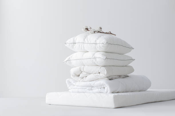 istock Soft Cotton Pillows on a White Mattress 1222652362
