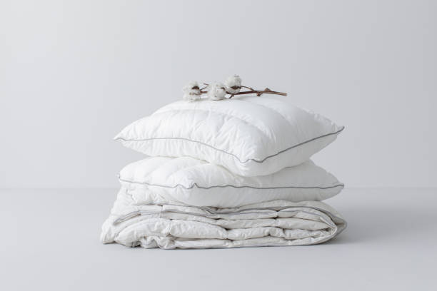 istock Fluffy White Cotton Pillows and a Duvet (Copy Space) 1222652365
