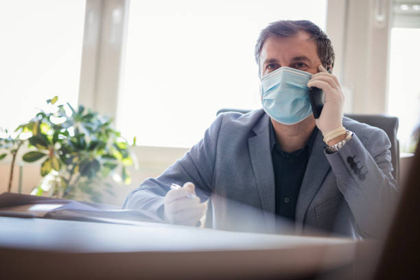 istock Man with phone indoors 1222655959