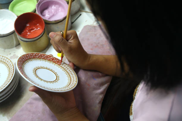 istock artist painting benjarong ceramic ware 1222656690