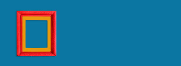 istock Red wooden frame on  blue background. Simple mockup for design. 1222658535