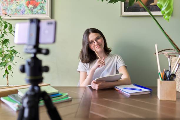 istock Girl student teenager studying online using smartphone, video conferencing 1222659484