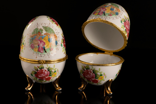 Jewelery Faberge eggs on a black table and a black background
