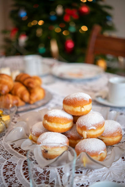 istock Christmas table with croissants and donuts 1222661512