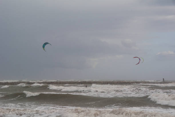 istock Several people skiing on a stormy day 1222665328