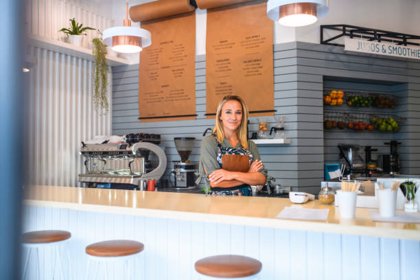 istock Smiling Blonde Barista Standing Behind Cafe Counter 1222667959