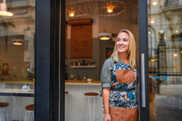 istock Confident Young Argentine Cafe Owner Standing at Front Door 1222667960