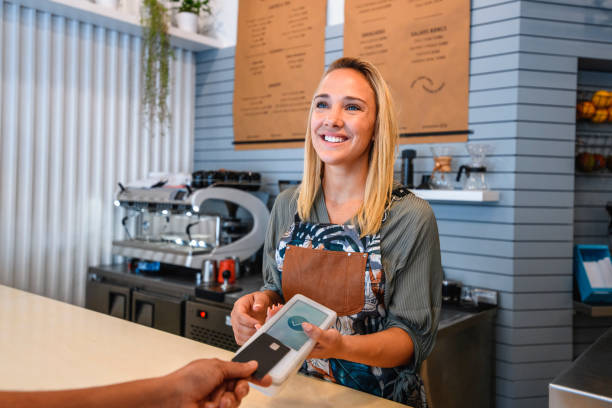 istock Close-Up of Customer Making Mobile Payment at Cafe 1222667977
